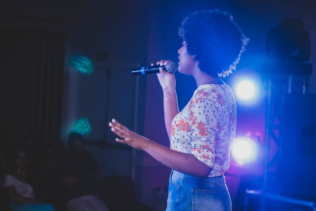 Woman singing on stage